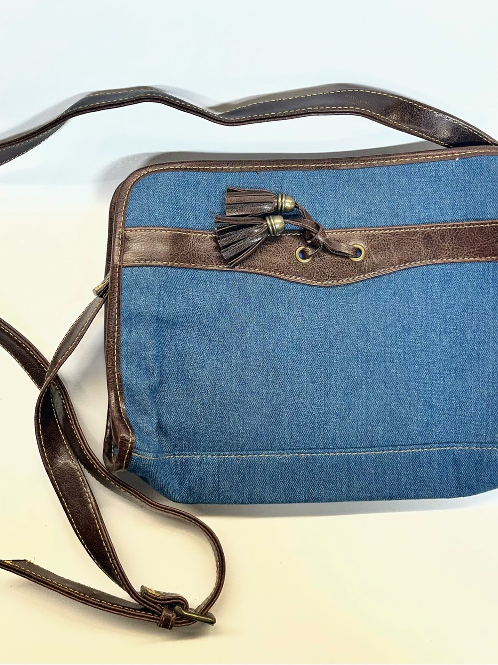 Denim Crossbody Bag with Brown Trim and Tassel Accent